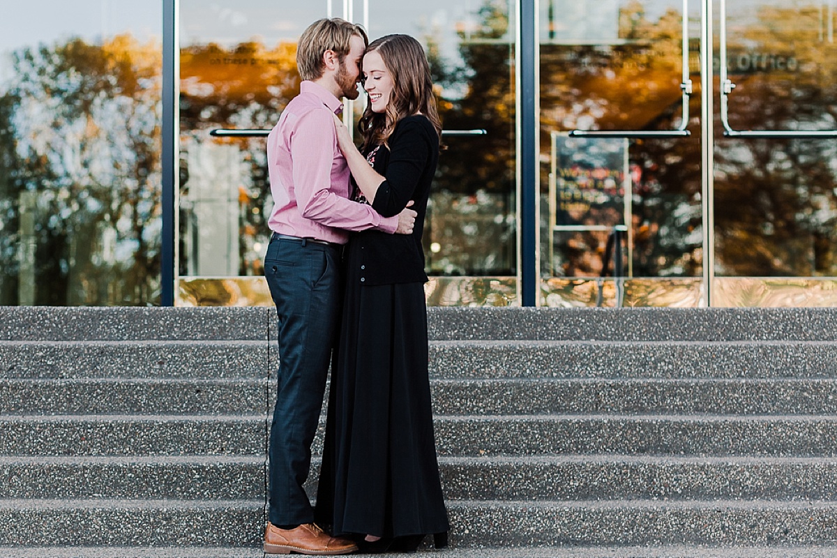 Couple standing in front of Guthrie Theatre for their Engagement session