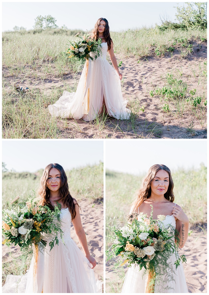 beautiful brunette bride holds large bouquet of peach and white flowers on a grassy beach