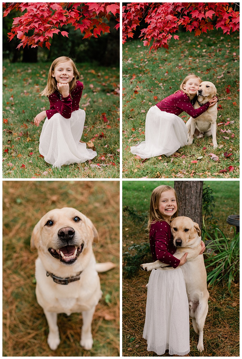 a little girl in a white dress and fuschia sweater plays with her adorable golden lab during some fun fall family photos with comfort and cashmere photography