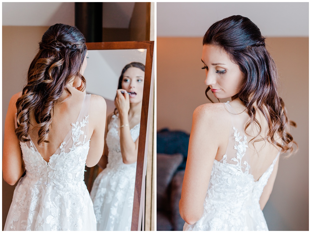 bride puts the finishing touches on her makeup and poses, revealing the beautiful lace back of her dress. Photo by comfort and cashmere