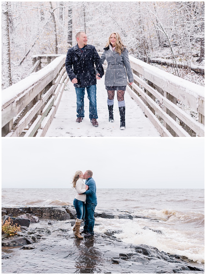 40-something man and women walk along a snow-covered bridge, hand in hand, then stop for a kiss beside the ocean