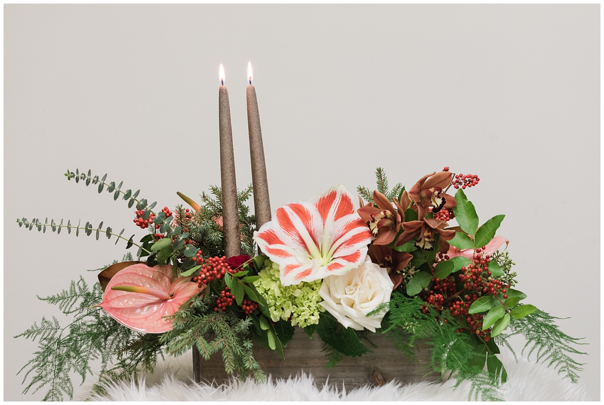 holiday floral design with candles created by Saffron and Grey floral design