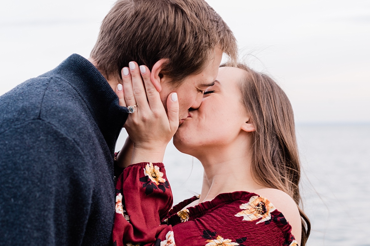 Attractive engaged couple kisses as they celebrate despite having their wedding postponed, photo by Comfort and Cashmere Images