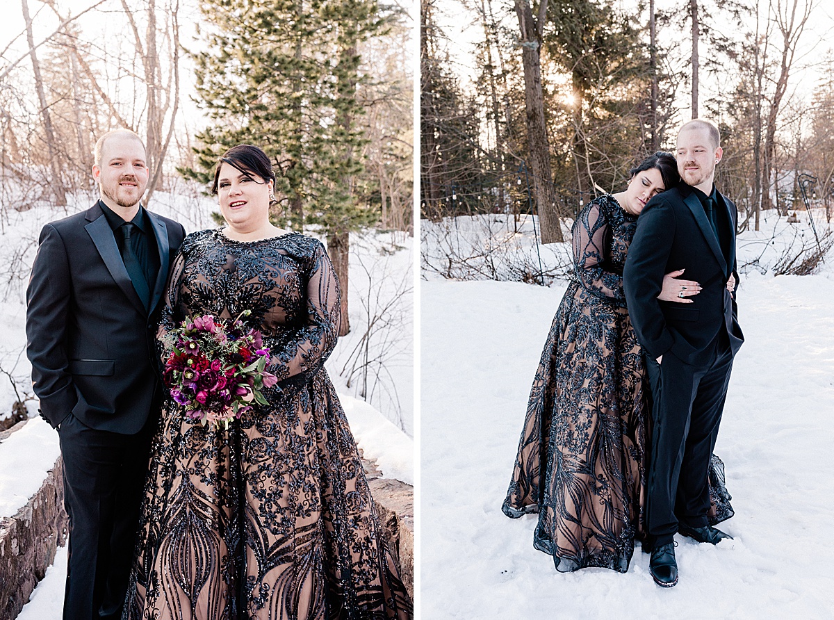 curvy bride wearing a black dress and her groom wearing a black suit with velvet accents pose for comfort and cashmere images in the snow of early spring in Minnesota