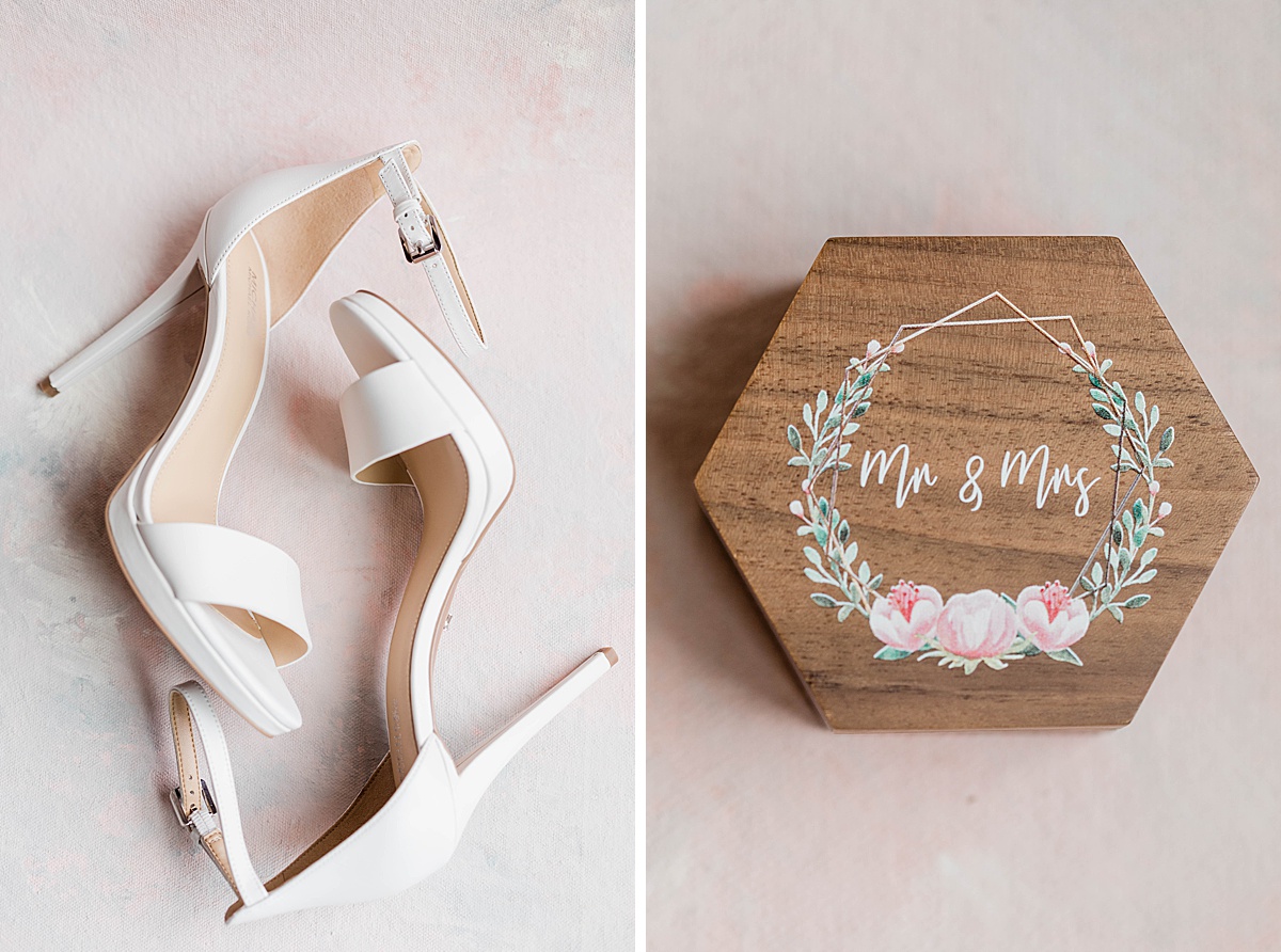 Michael kors wedding heels laying on the floor beside a personalized wooden ring box that says Mr and Mrs on it.