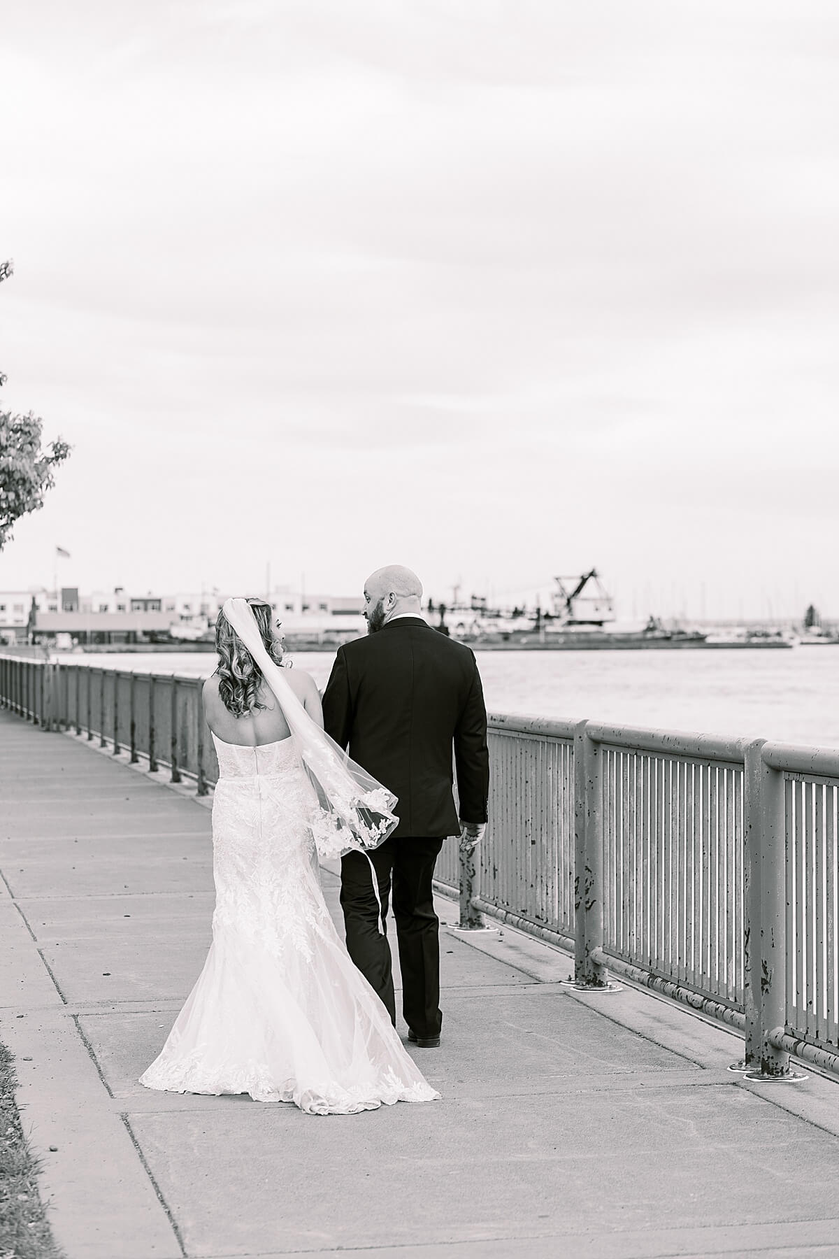 bride and groom portraits near lake superior in canal park