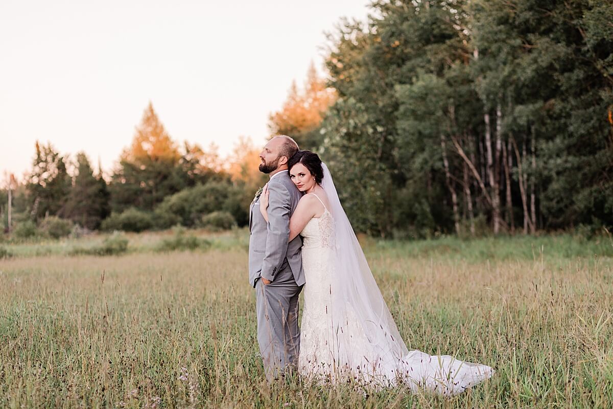 Northern wisconsin wedding sunset couple portraits in a field 