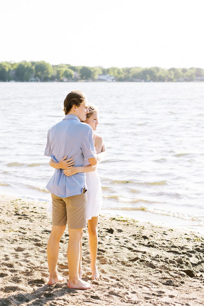 couple standing on beach at weaver lake park