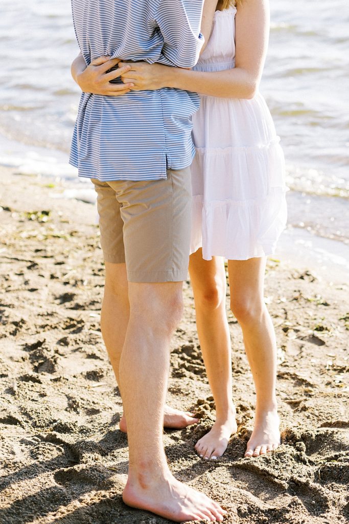 couple hugging along the beach
